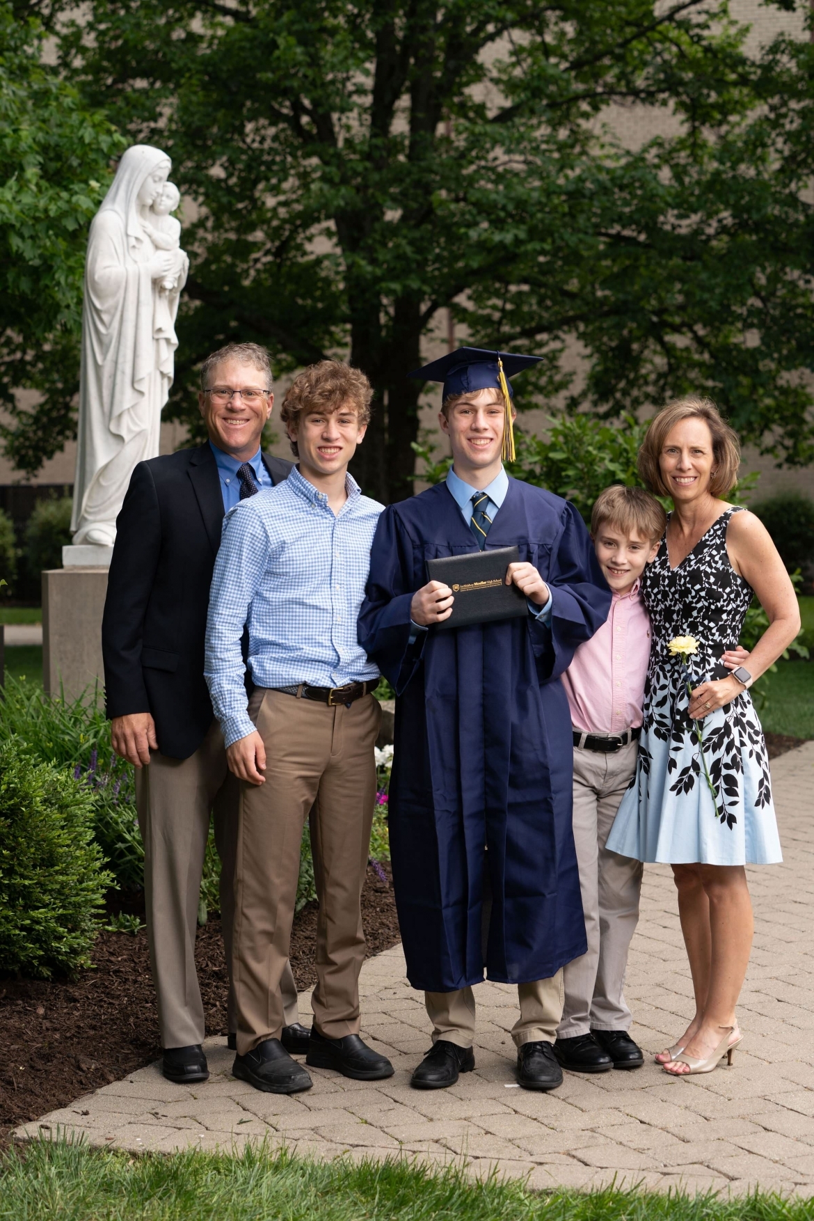 family with boy who just graduated